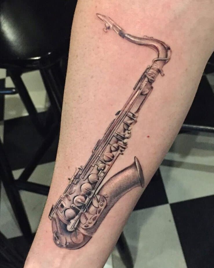 2. A soft and subtle saxophone tattoo 