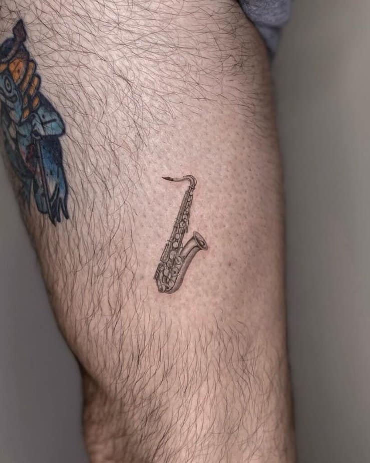 23. A tiny saxophone tattoo 