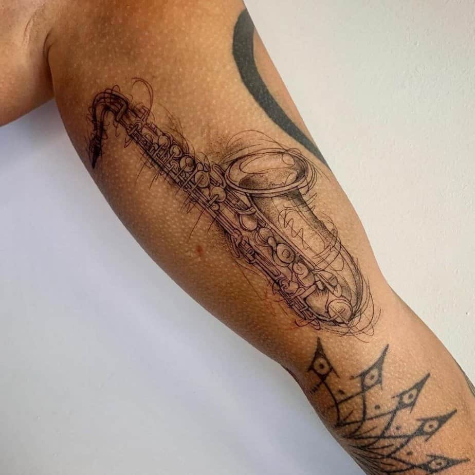 24. A saxophone sketch tattoo 