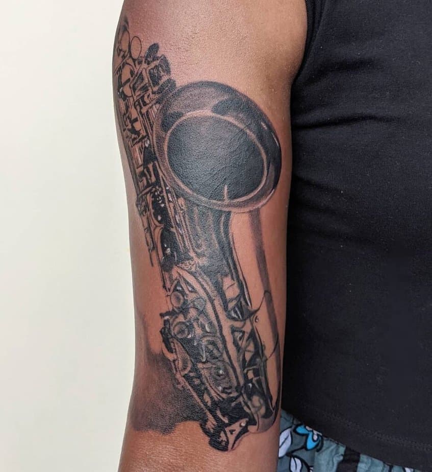 25. A blackwork saxophone tattoo
