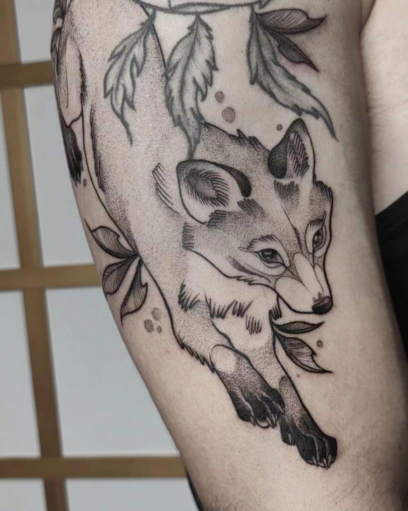 Black and gray fox tattoo
