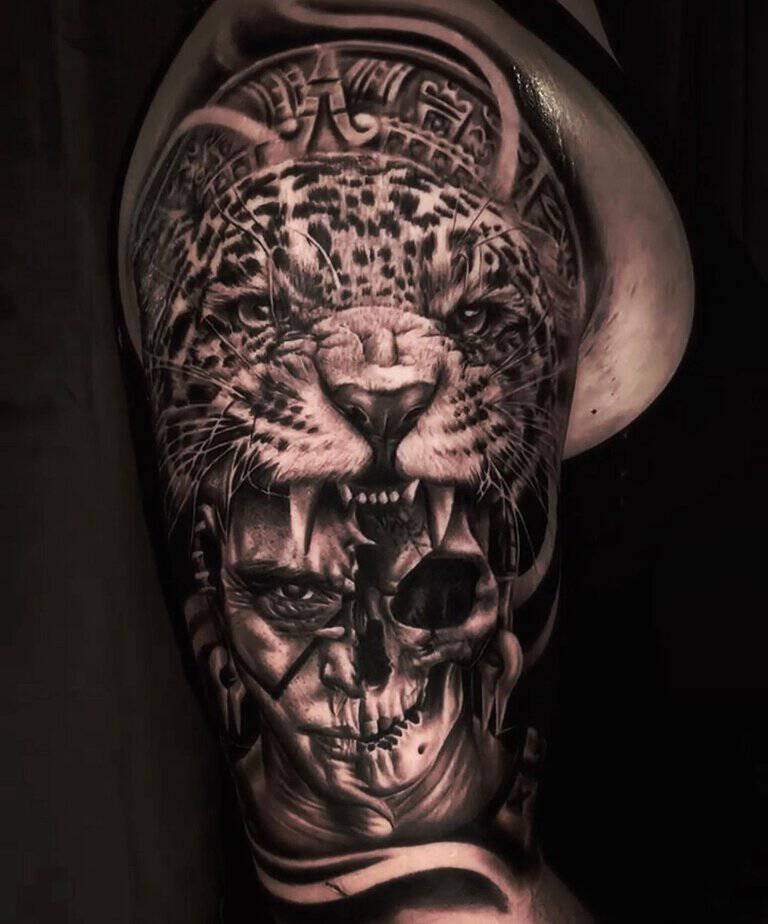 4. Intense Aztec jaguar and skull arm tattoo