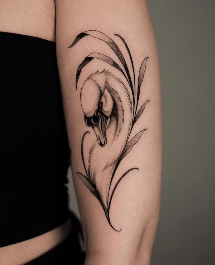 6. Elegant swan tattoo