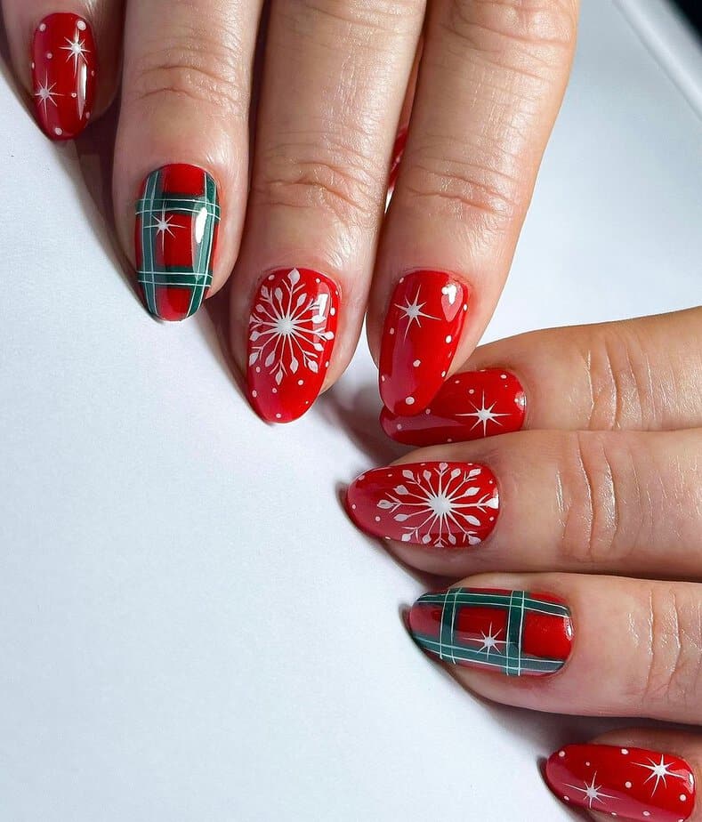 8. Festive plaid and snowflake nails