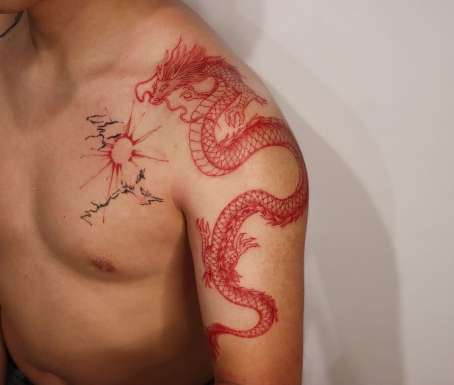 9. A red dragon tattoo and a red sun
