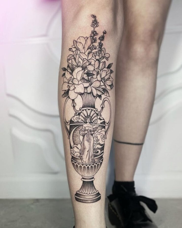 A Grecian vase tattoo on the shin