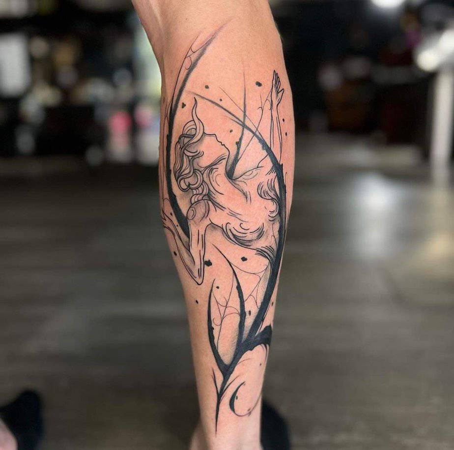 15. A Sagittarius tattoo on the back of the leg
