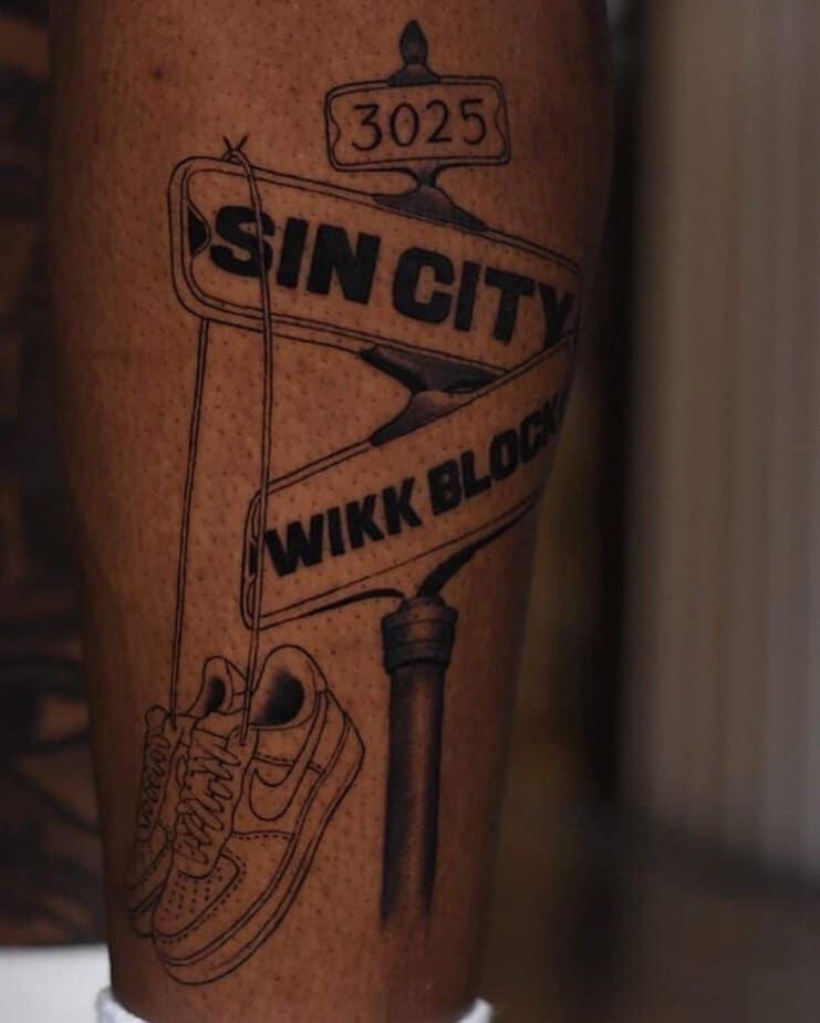 13. A Sin City street tattoo on the leg
