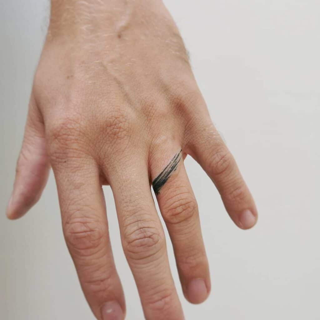 A brushstroke ring tattoo