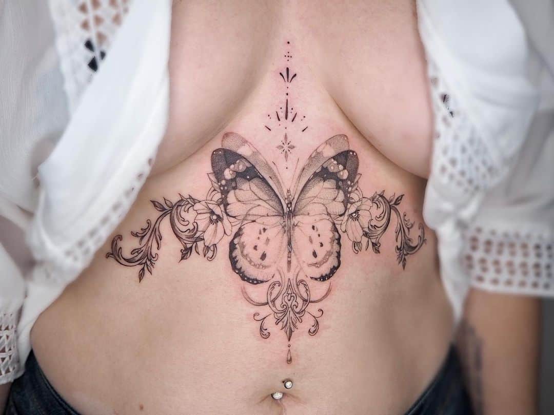 A butterfly middle chest tattoo