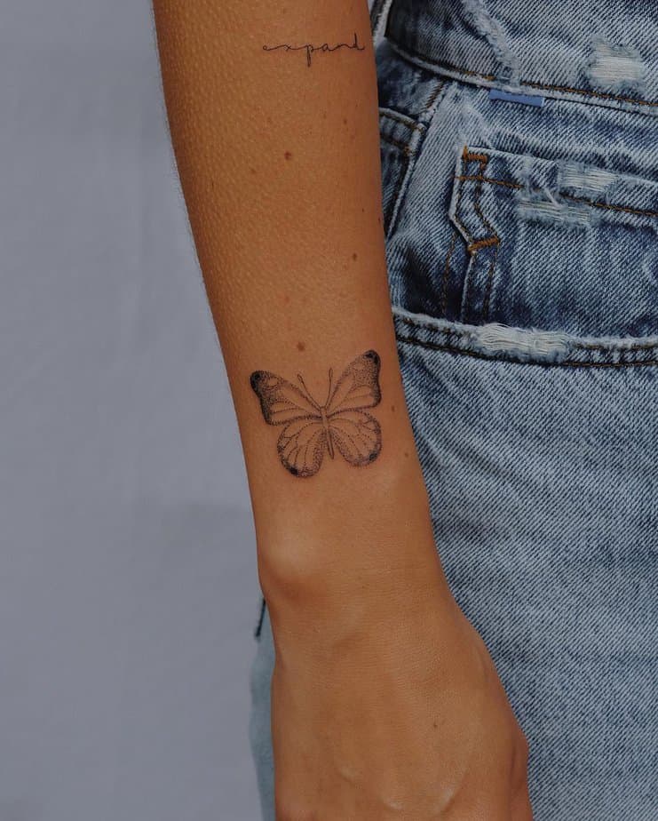 A butterfly tattoo on the wrist
