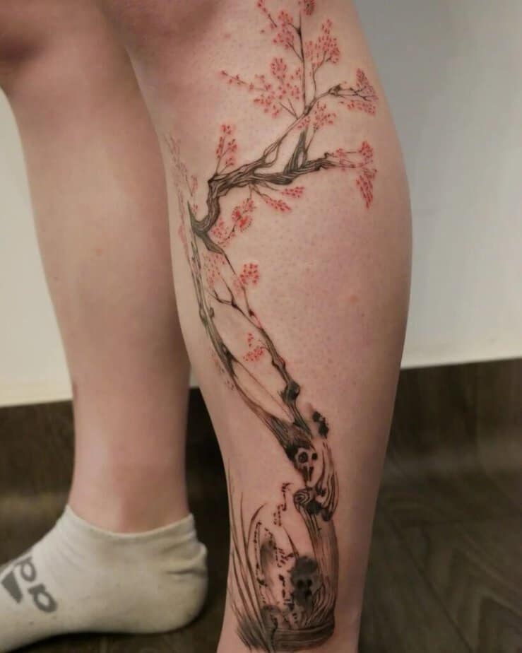 A cherry blossom tattoo on the shin