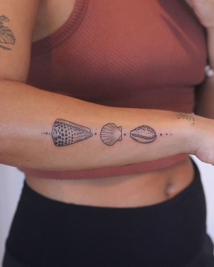 22. A collection of shells on the forearm
