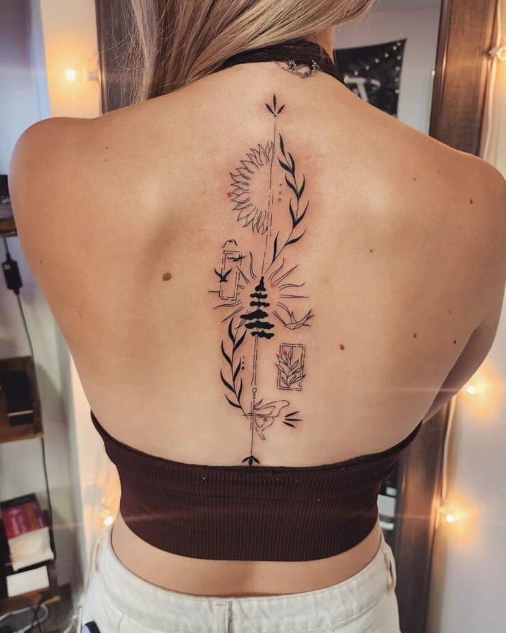 Un simpatico tatuaggio sulla spina dorsale con dettagli intricati