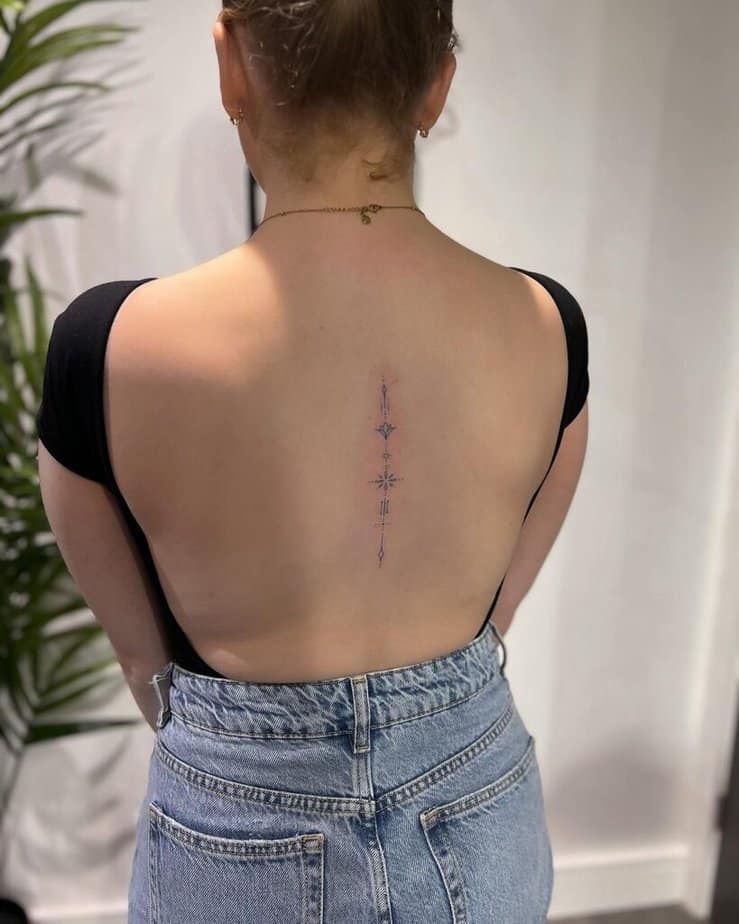 A dainty and delicate spine tattoo
