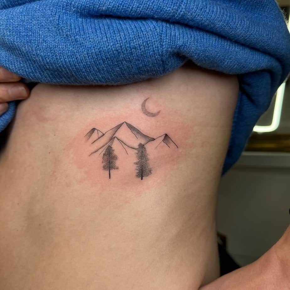 8. A dotwork mountain tattoo
