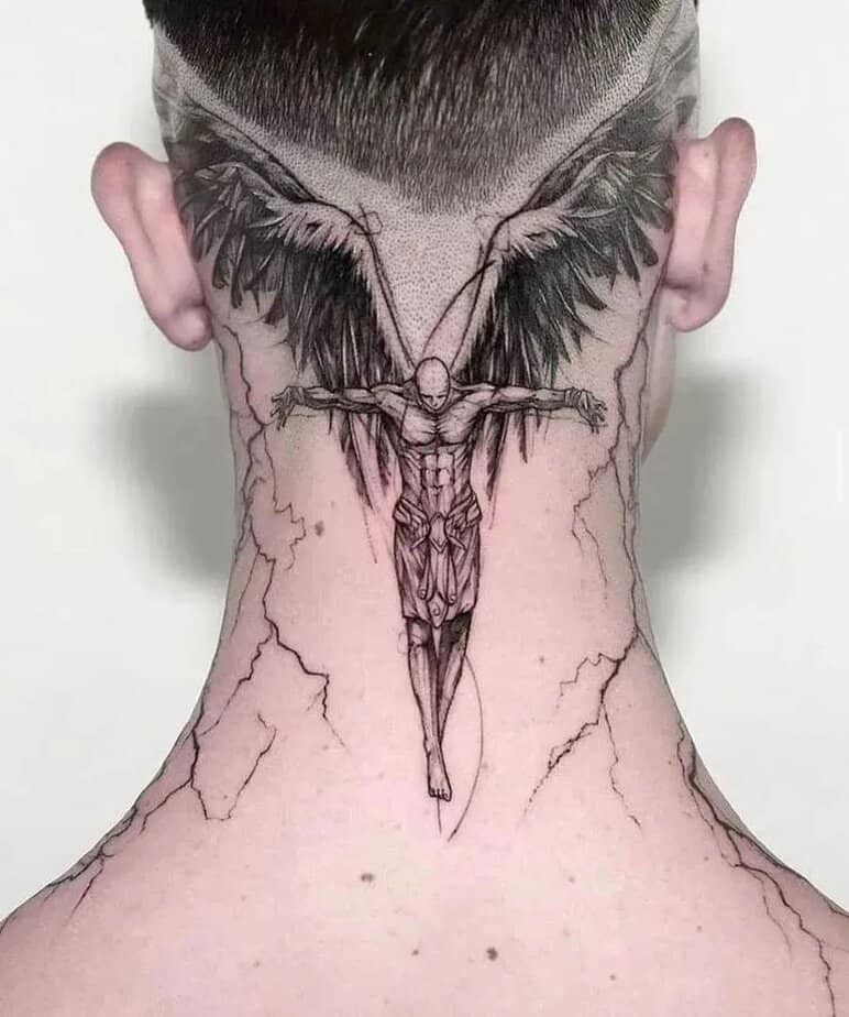 7. A fallen angel tattoo on the upper trap and head
