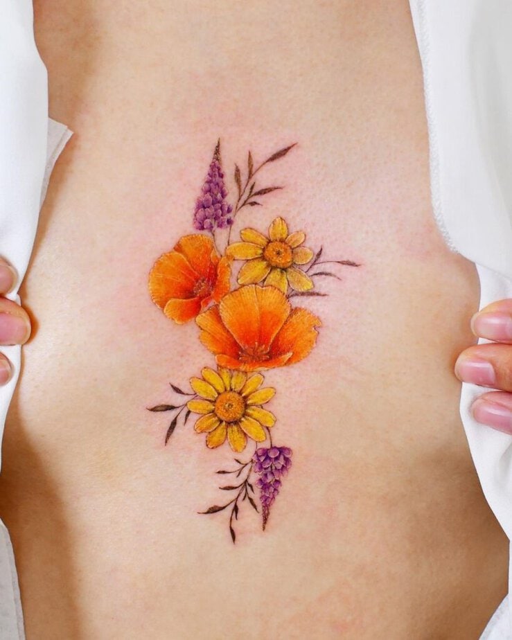A fiery, floral tattoo on the sternum