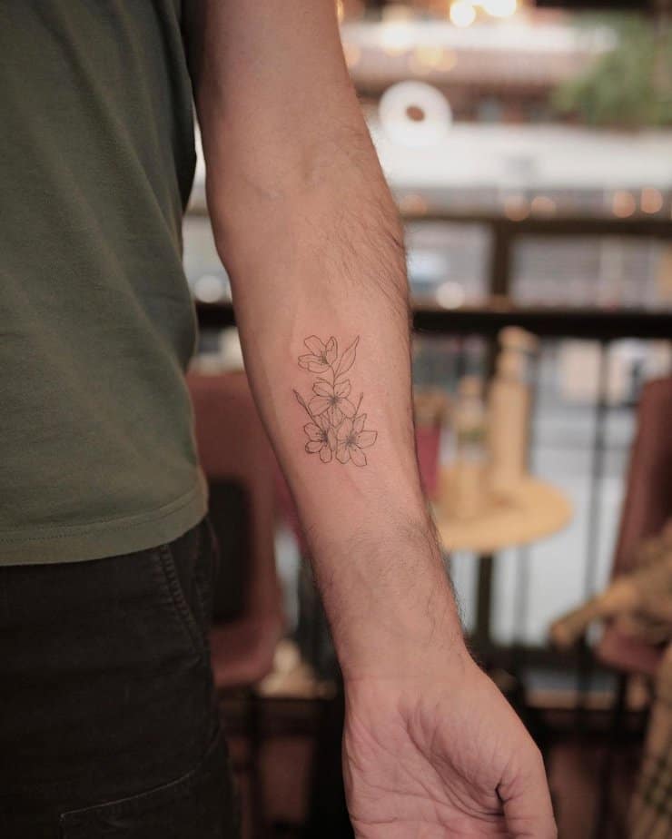 16. A fine-line jasmine tattoo
