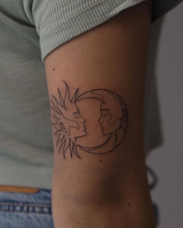 A fine-line sun and moon tattoo
