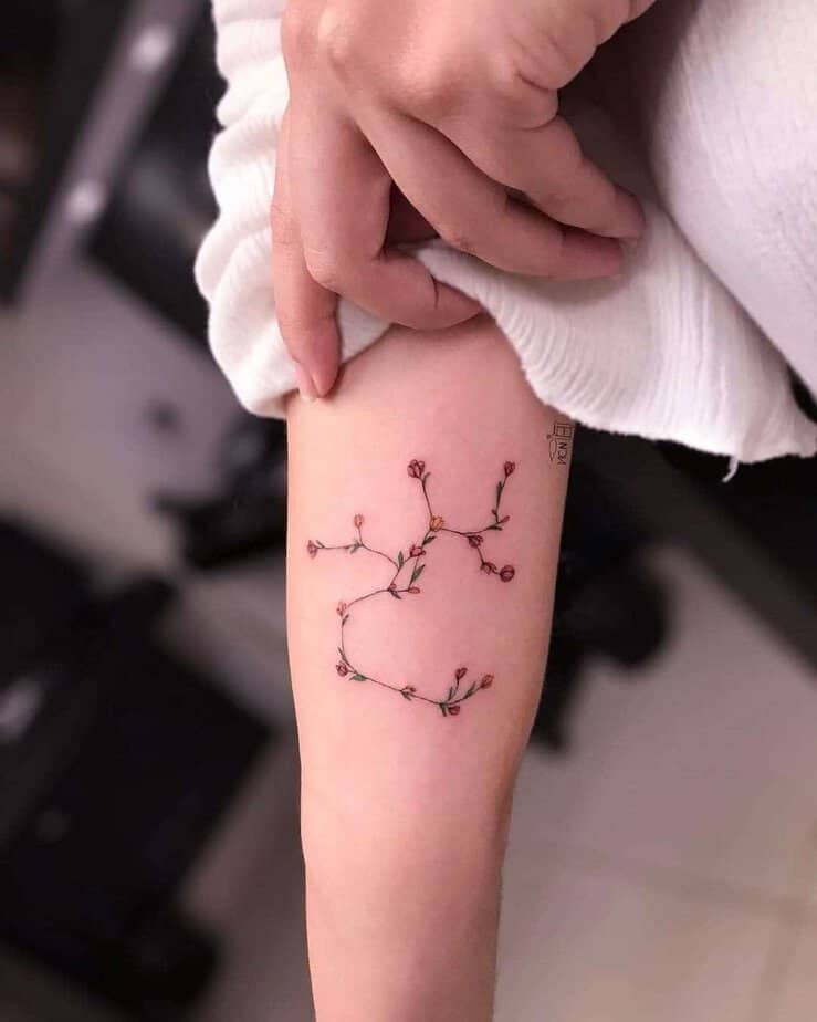 10. A floral Sagittarius constellation tattoo
