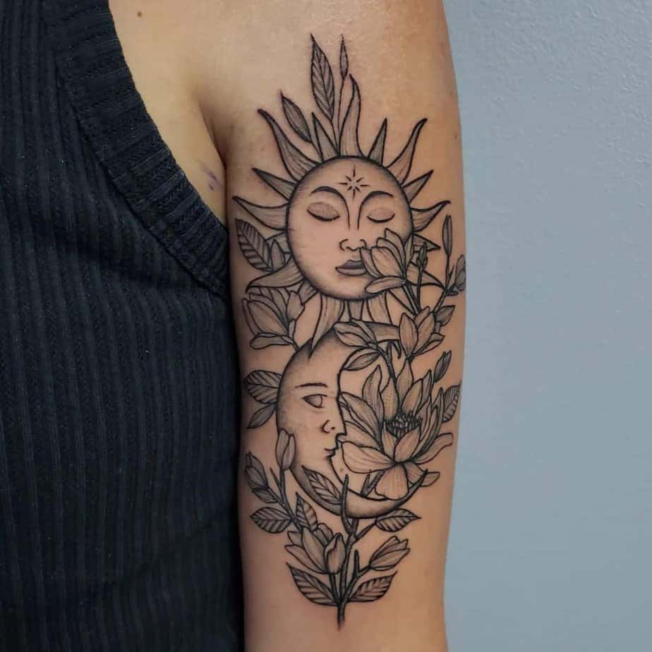 A floral sun and moon tattoo