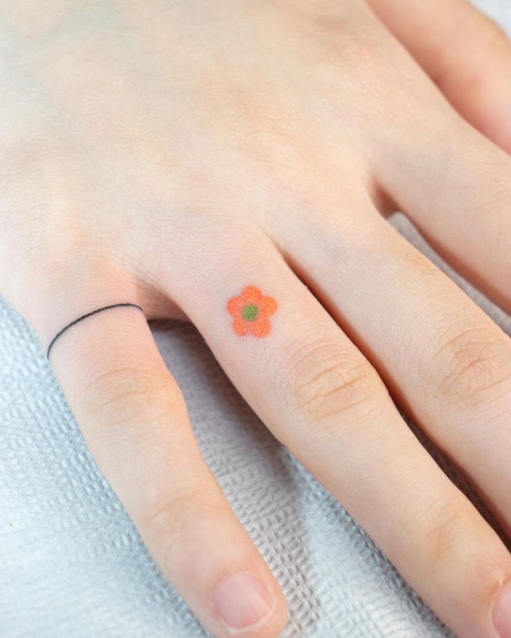 A flower and a line ring tattoo