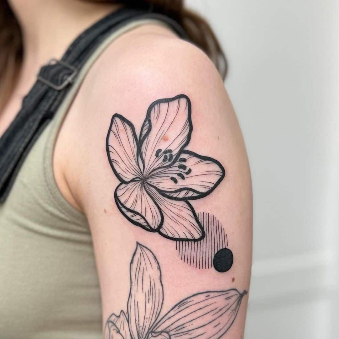 15. A graphic jasmine tattoo
