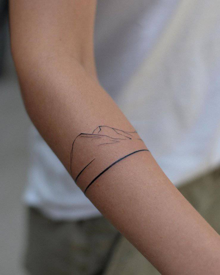 5. A minimalist mountain tattoo
