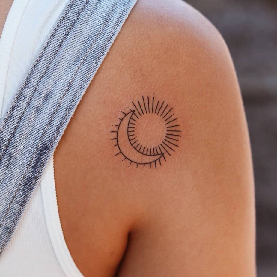 A minimalistic sun and moon tattoo