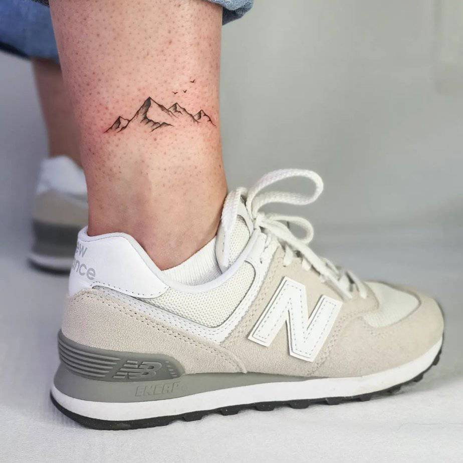2. A mountain tattoo above the ankle
