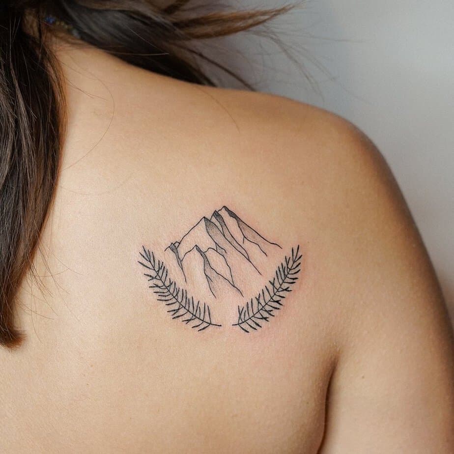 11. A mountain tattoo on the back
