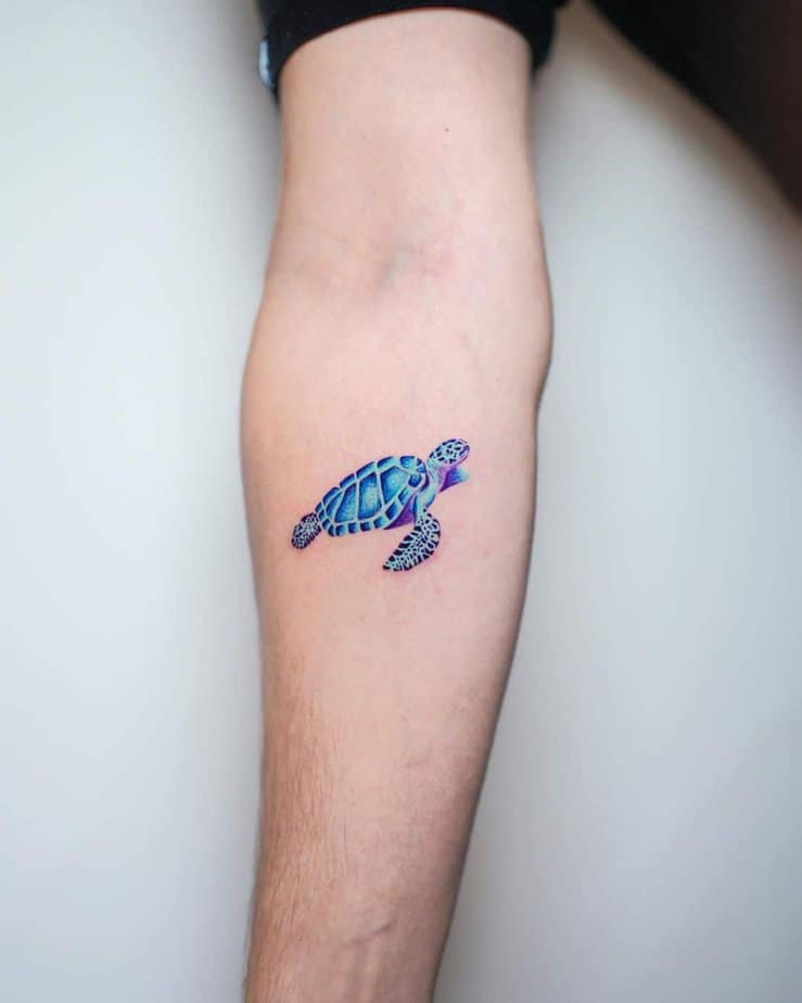 17. A tattoo of a bright blue sea turtle

