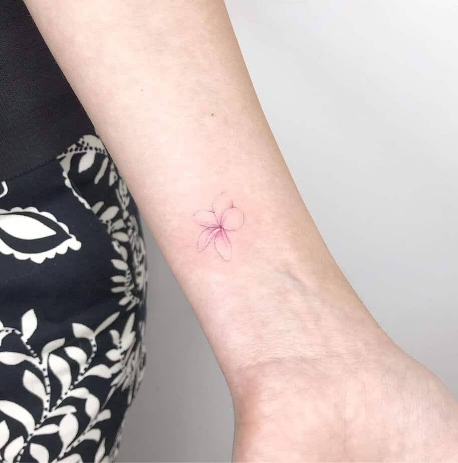 6. A tiny jasmine tattoo
