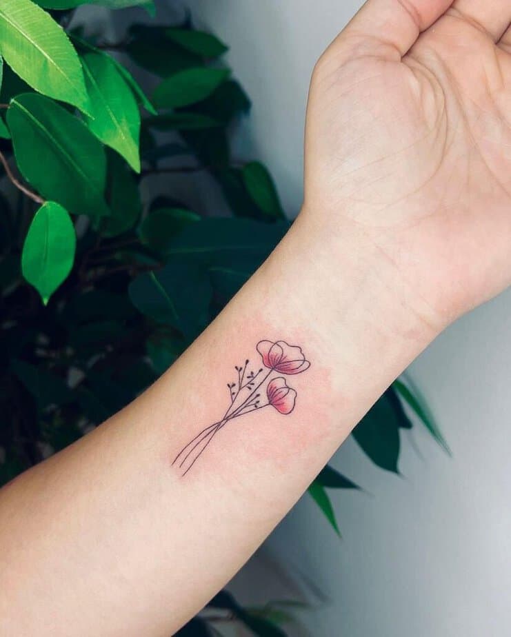 A tiny poppy flower tattoo