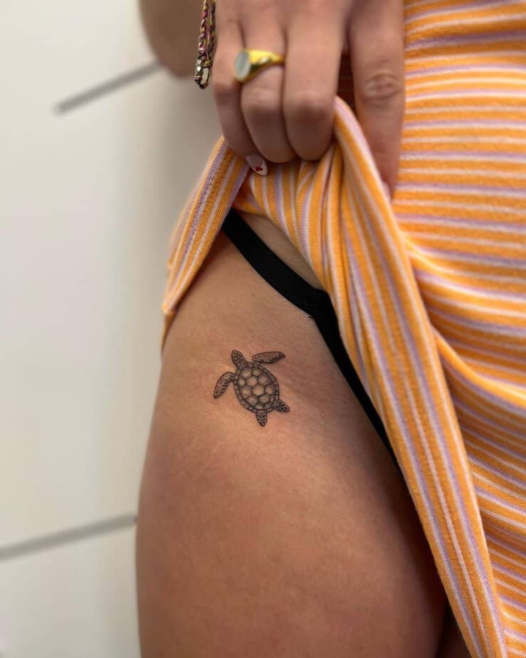 5. A tiny sea turtle tattoo on the hip

