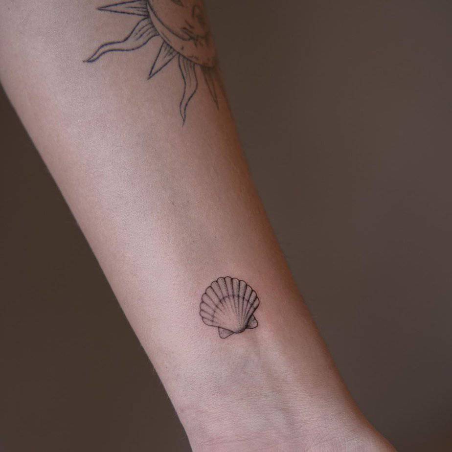 12. A tiny shell tattoo on the wrist
