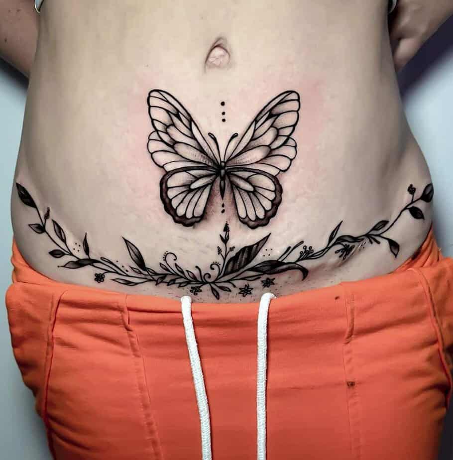 4. A tummy tuck tattoo with a big butterfly
