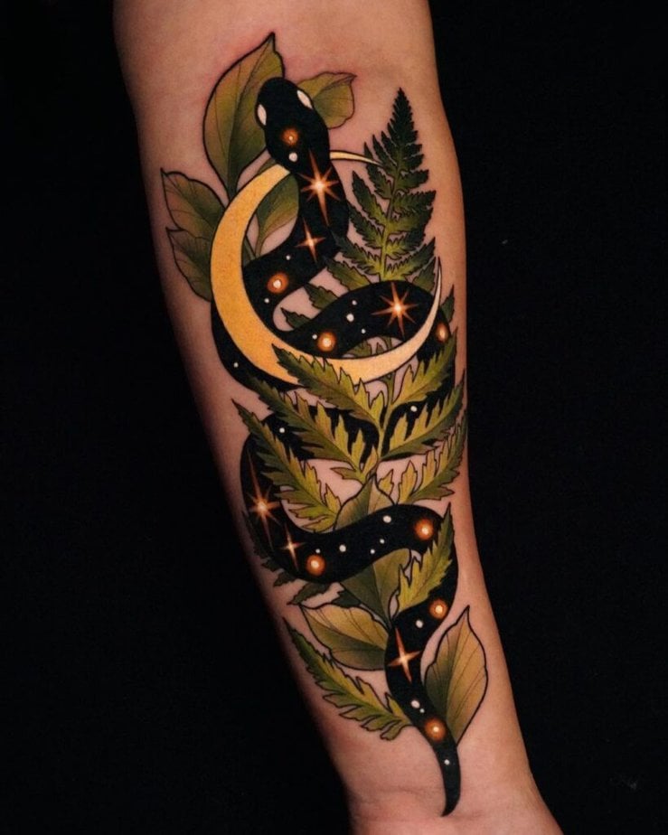 Enchanting snake and flowers tattoo