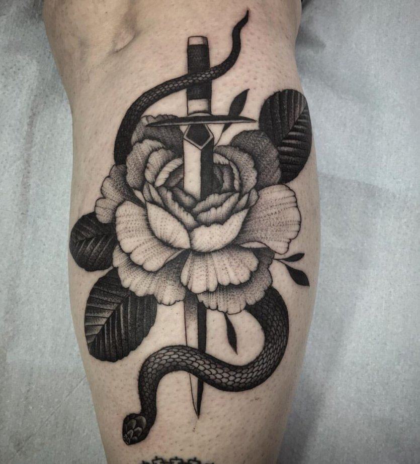 Snake with flowers and a sword or dagger
