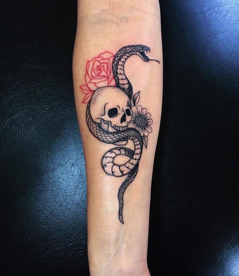 Snake with flowers and a skull
