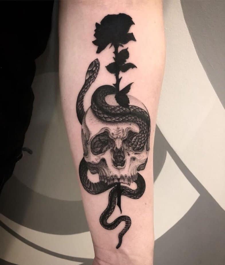 Snake with flowers and a skull