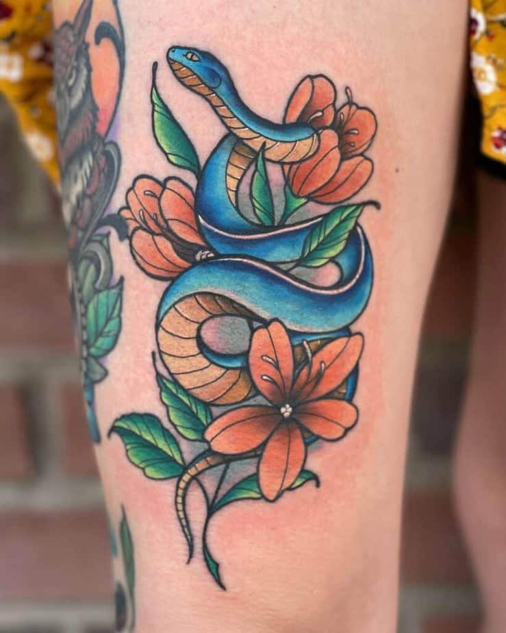 Colorful snake and flowers tattoo
