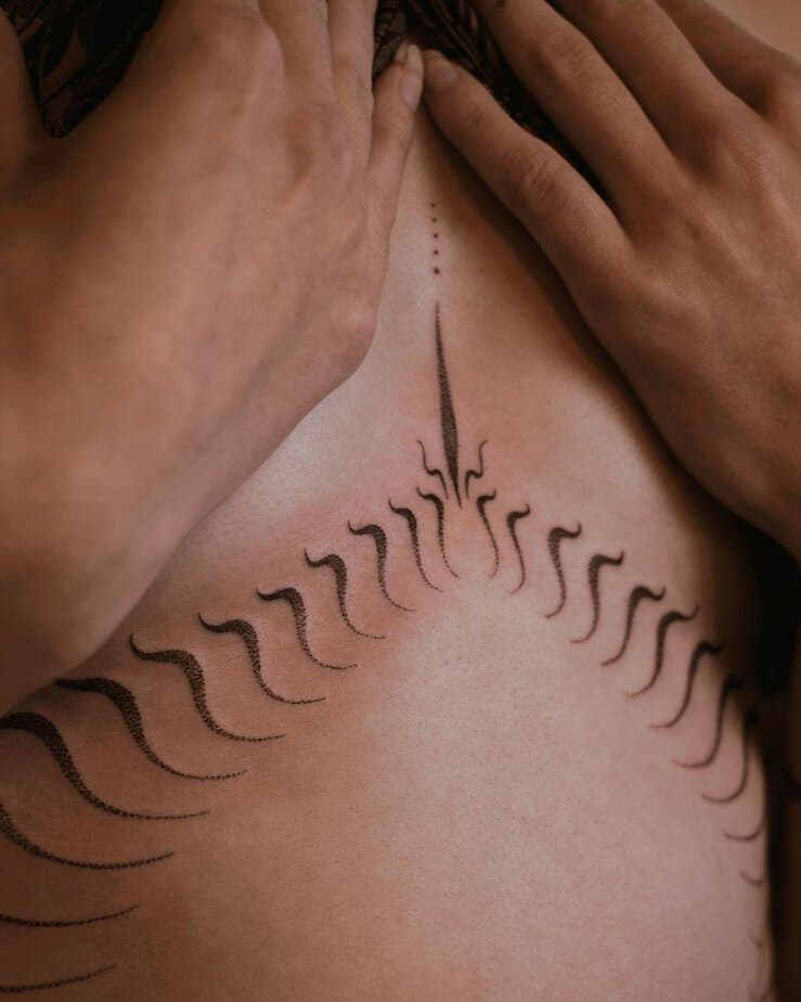 An abstract middle chest tattoo