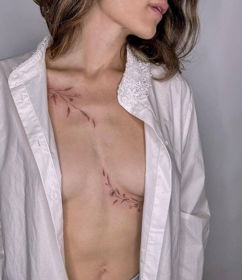 An asymmetric middle chest and shoulder tattoo