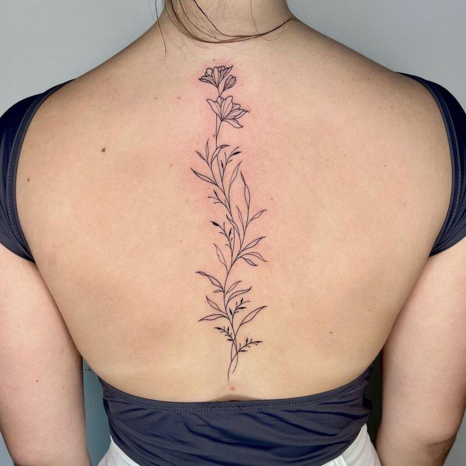 An effortless floral spine tattoo
