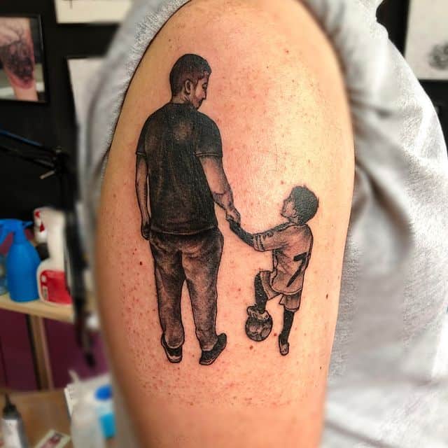 6. Beautiful father and son tattoo
