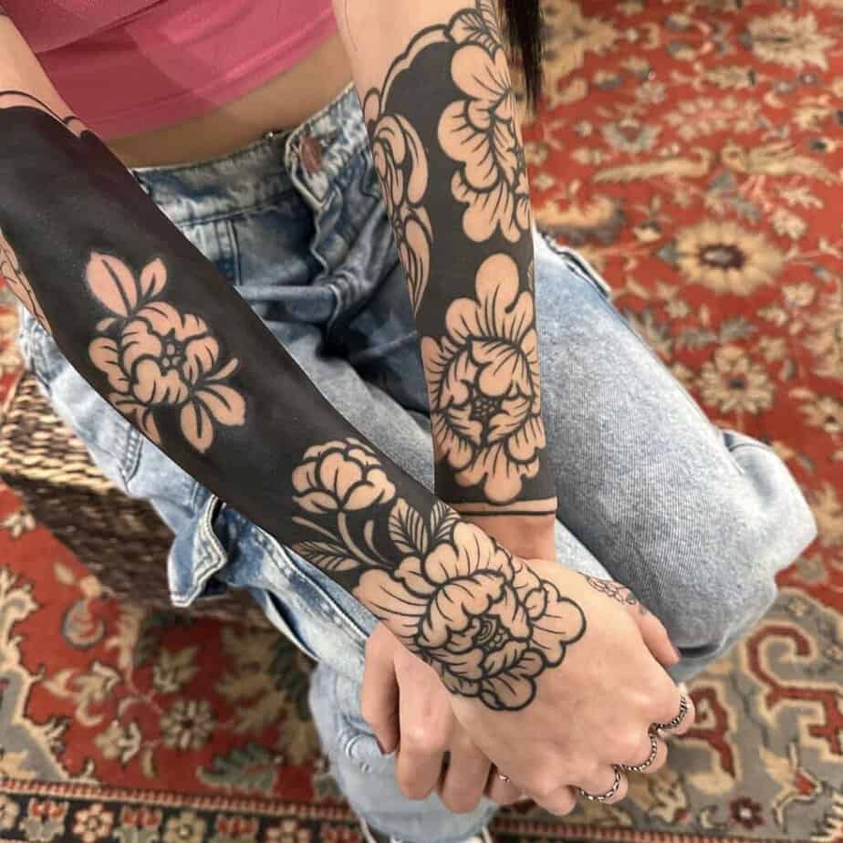 Blackout floral tattoo