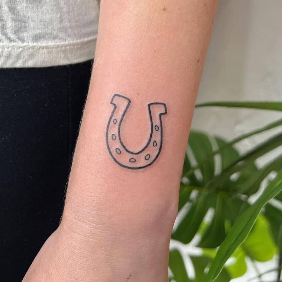 12. A horseshoe tattoo 