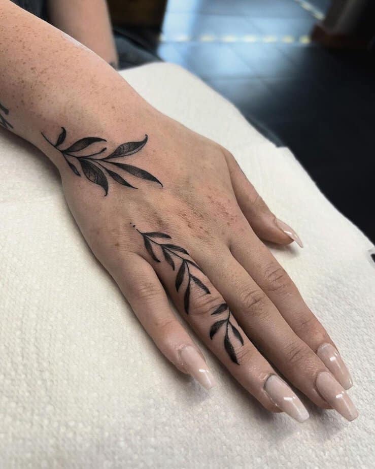 3. A flowy, floral finger tattoo
